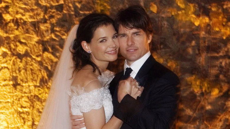 Katie Holmes and Tom Cruise pose together on their wedding day