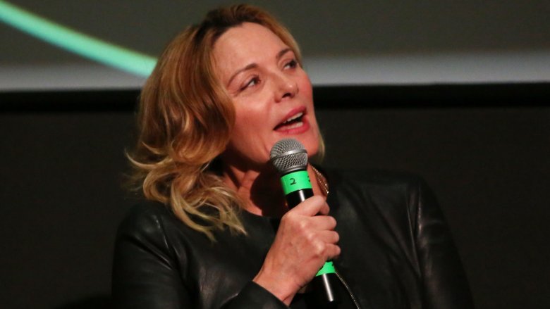 Kim Cattrall speaking into mic