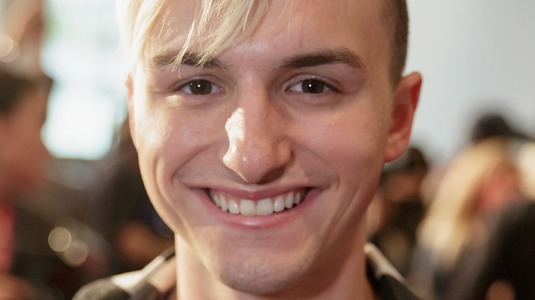 Lucas Cruikshank smiling with bleach blond hair