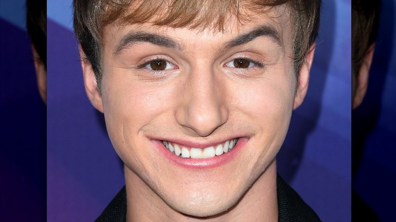 Lucas Cruikshank smiling on the red carpet