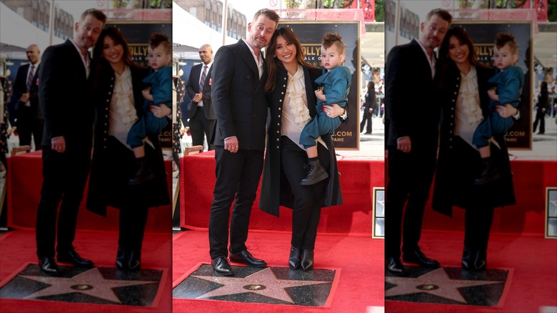 Macaulay Culkin posing for photographers with his wife and child as he receives a star on the Hollywood Walk of Fame in December 2023