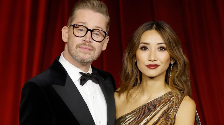 Macaulay Culkin and his wife Brenda Song posing for photographers at a red carpet gala in Los Angeles in October 2024