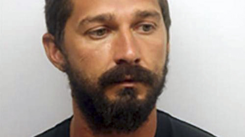 Shia LaBeouf posing for a mugshot