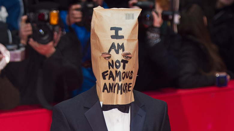 Shia LaBeouf posing with a paper bag