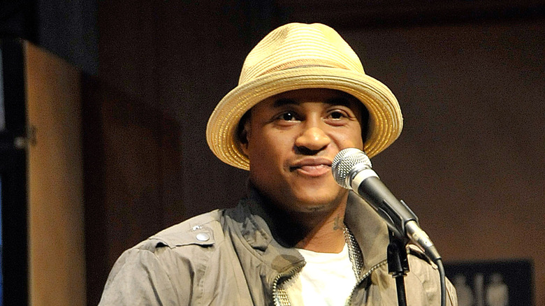 Orlando Brown stands in front of microphone 