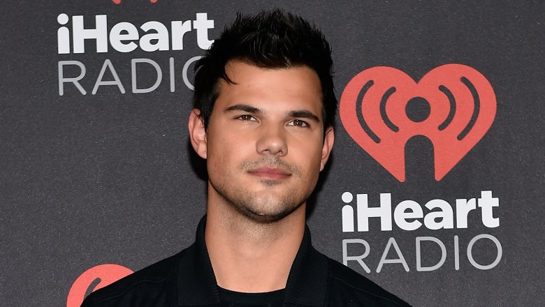 Taylor Lautner in dark shirt