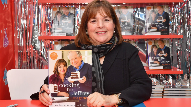 Ina Garten holding cookbook