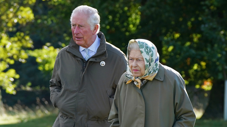 Prince Charles and Queen Elizabeth II walking together