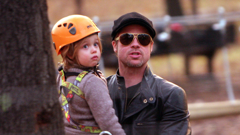 Brad Pitt holding 4-year-old Shiloh Jolie-Pitt in 2010.