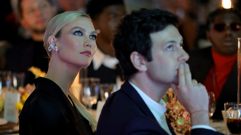 Karlie Kloss and Joshua Kushner looking up