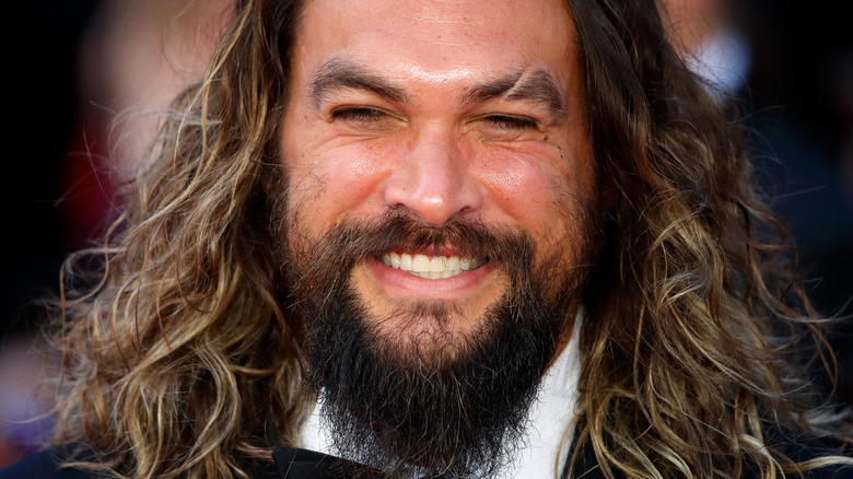 Jason Momoa posing for cameras 