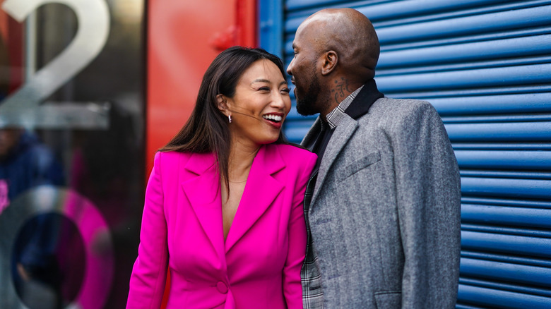 Jeannie Mai and Jeezy cuddling outside Pamella Roland