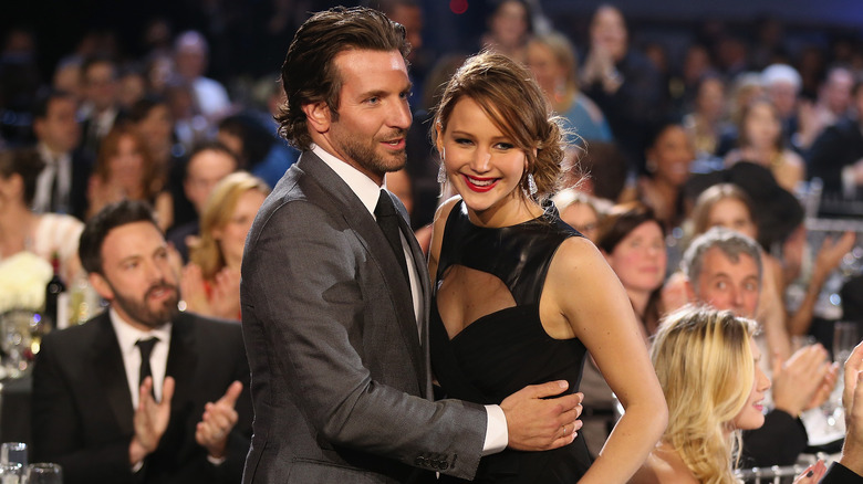 Bradley Cooper hugging Jennifer Lawrence