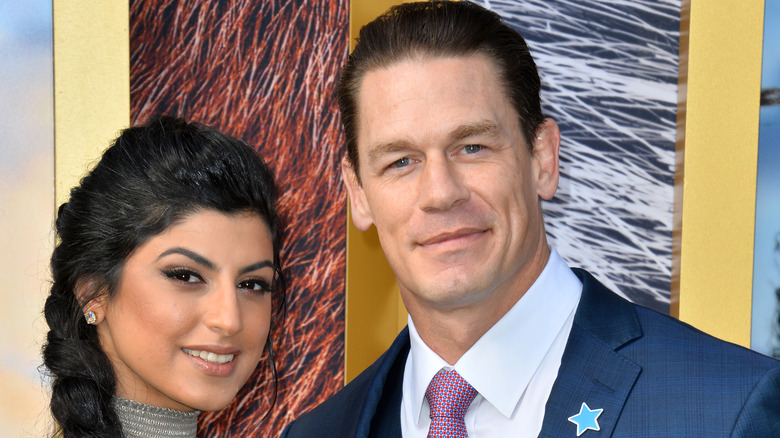 Shay Shariatzadehand John Cena on the red carpet.