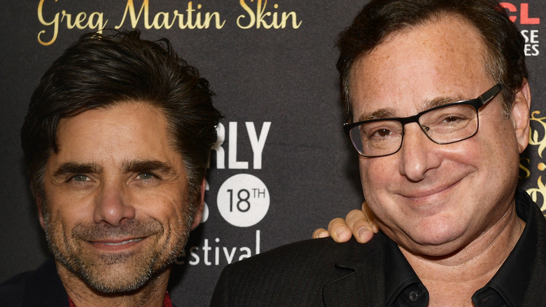 John Stamos stubble beard Bob Saget black rim glasses