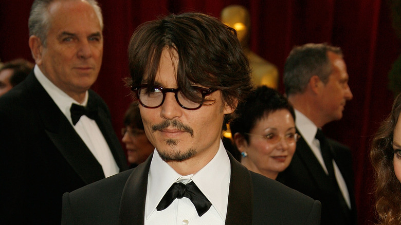 Johnny Depp poses on the red carpet 