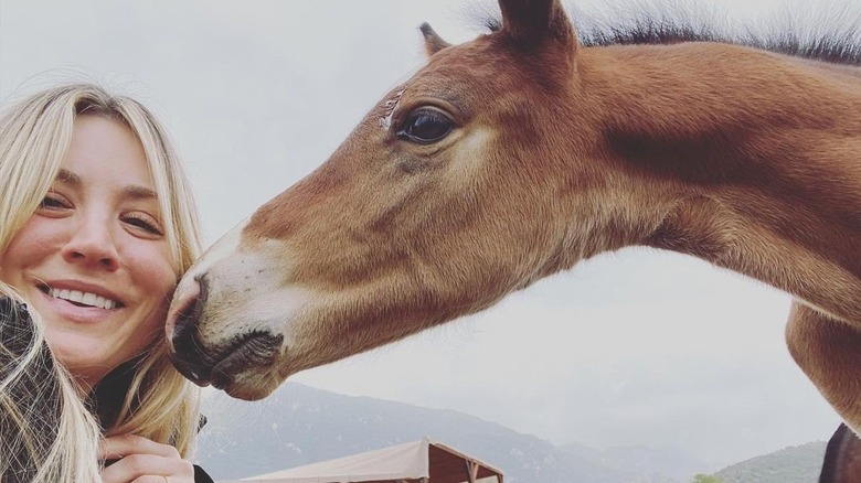 Kaley Cuoco smiling with foal