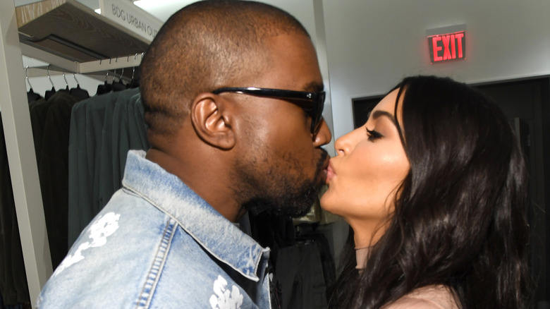 Kanye West and Kim Kardashian kissing