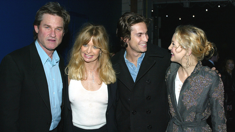 Kate and Oliver Hudson pose with Kurt Russell and Goldie Hawn