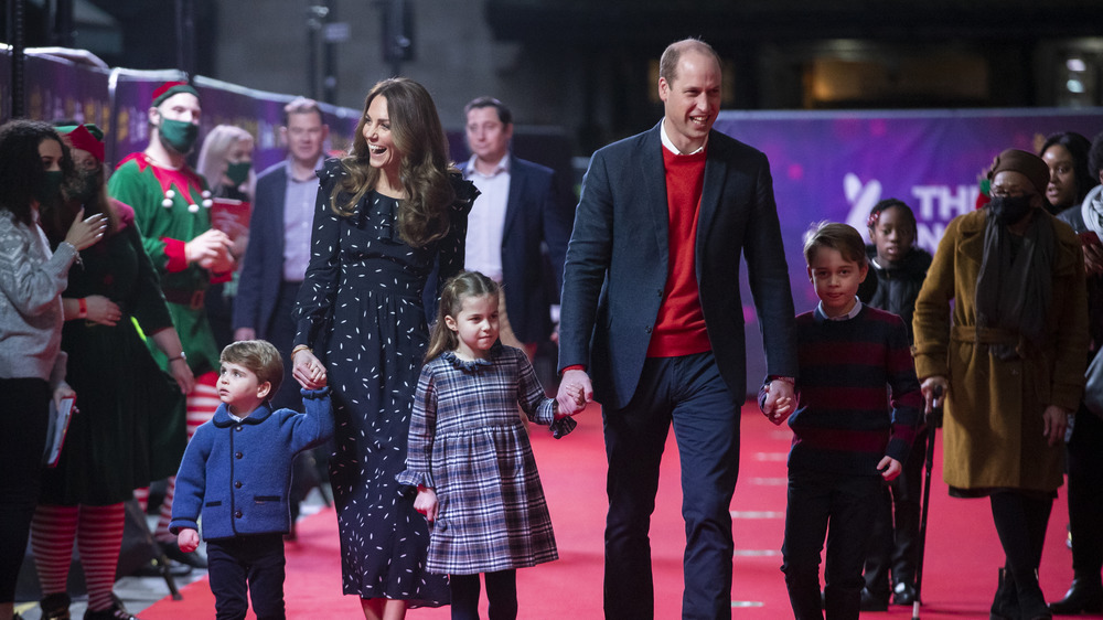 Kate Middleton and Prince William walk with their children