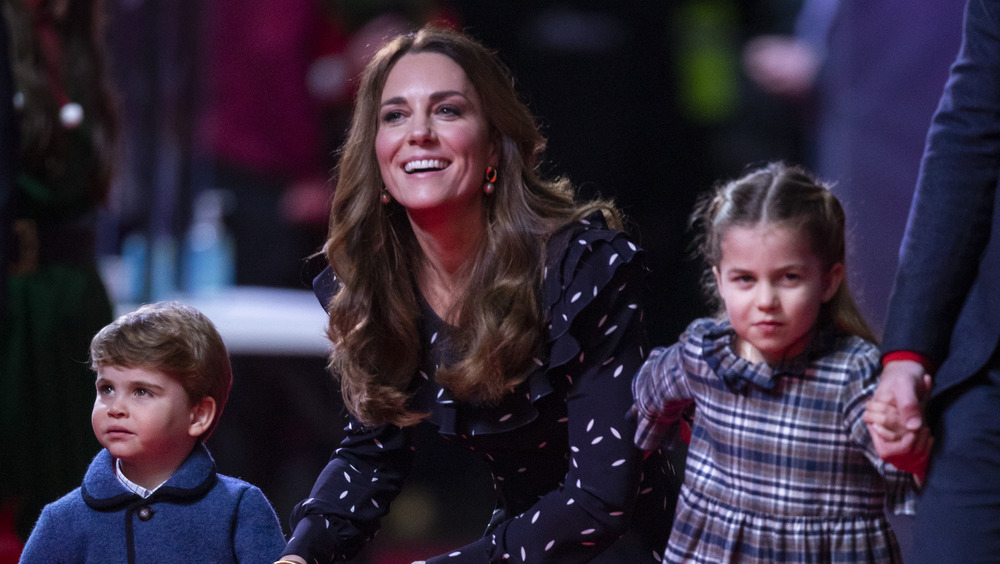 Kate Middleton kneeling with kids