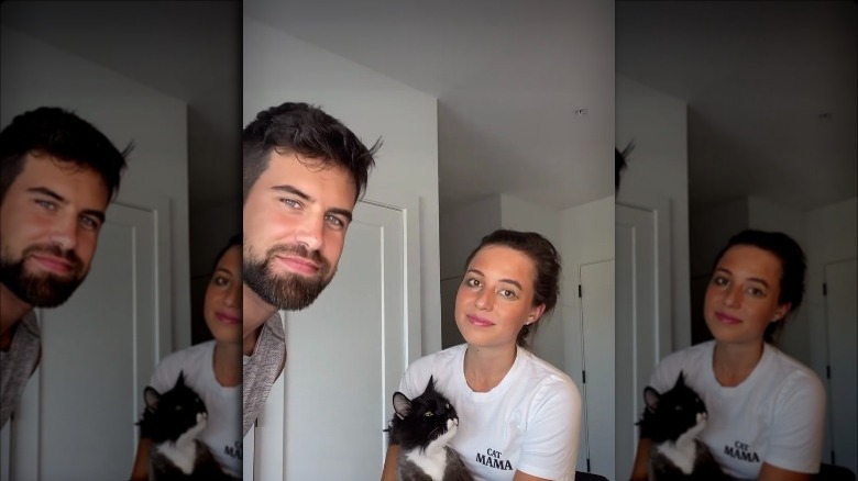 Blake Moynes, Tommy the cat, and Katie Thurston filming makeup tutorial