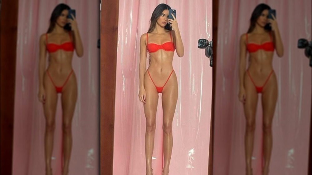 Kendall Jenner taking mirror selfie in red underwear