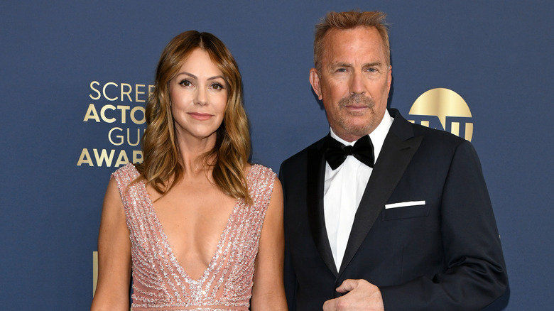 Kevin Costner and Christine Baumgartner formalwear