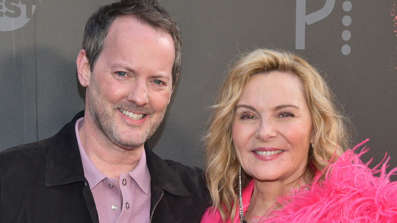 Kim Cattrall posing with Russell Thomas