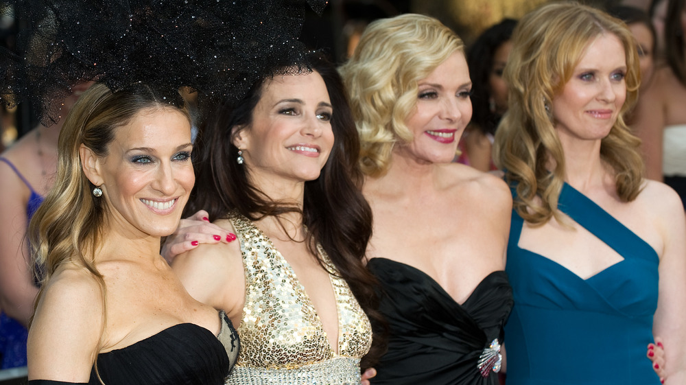 Sarah Jessica Parker, Kristin Davis, Kim Cattrall, Cynthia Nixon smiling at event