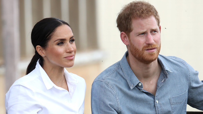 Prince Harry with wife Meghan Markle