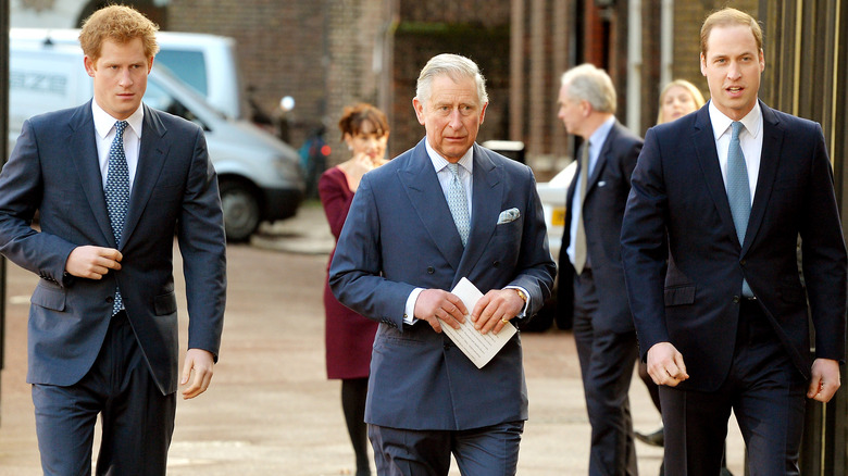 King Charles walking with Princes William and Harry