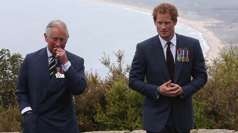 King Charles and Prince Harry walking