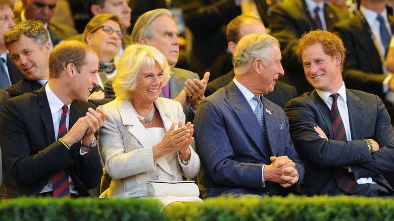 Prince William, Queen Consort Camilla, King Charles, and Prince Harry sitting together
