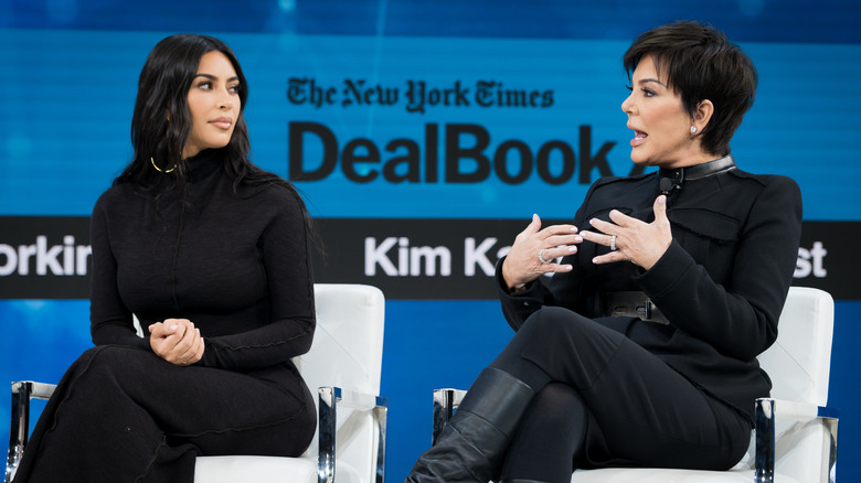 Kim Kardashian and Kris Jenner sit on a panel