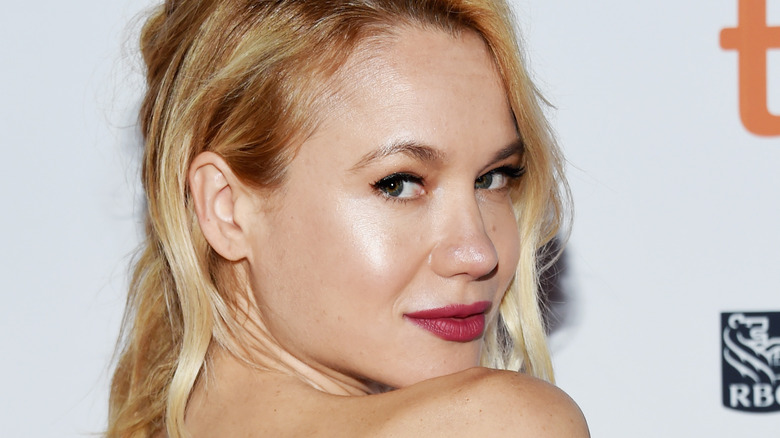 Kristen Hager looking over shoulder red lip