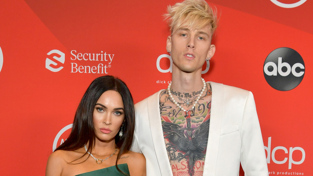 Megan Fox and Machine Gun Kelly posing on the red carpet