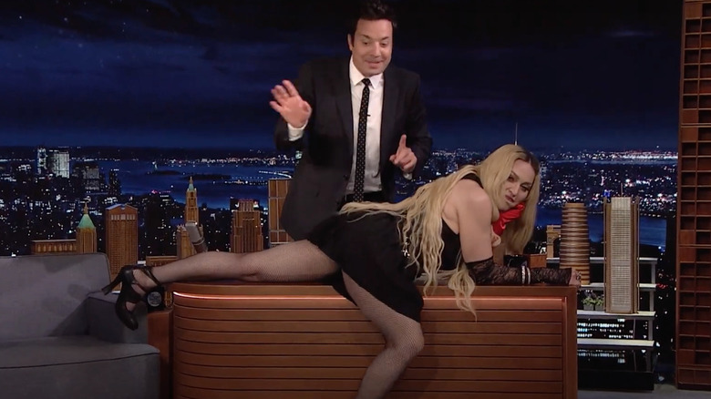 Madonna poses on Jimmy Fallon's desk