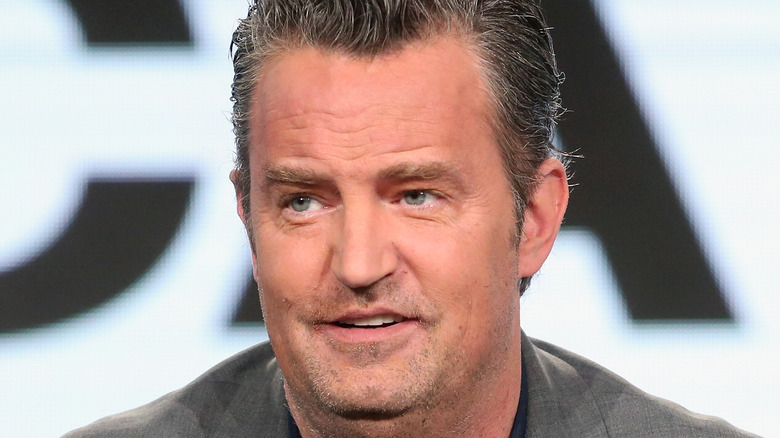 Matthew Perry speaks onstage