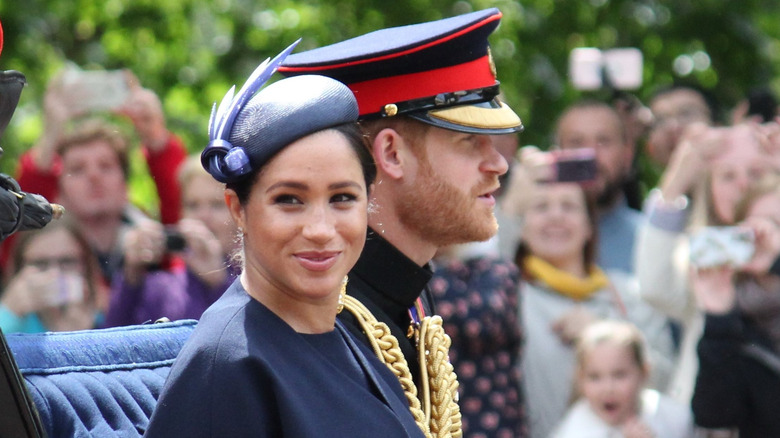 Meghan and Harry in a carraige