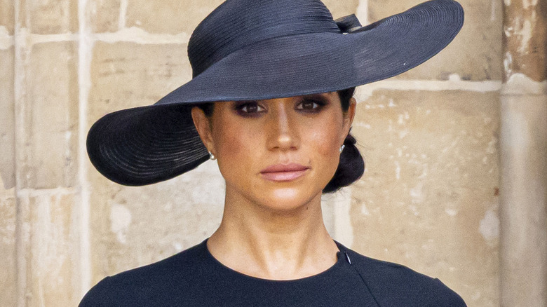 Meghan Markle wearing black hat