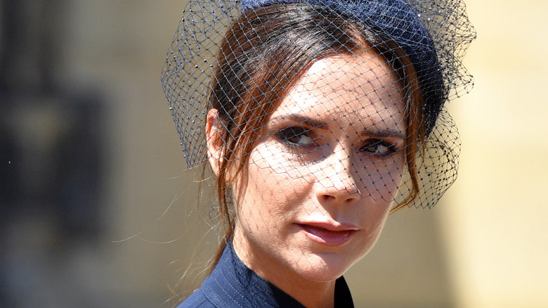 Victoria Beckham wearing netted fascinator