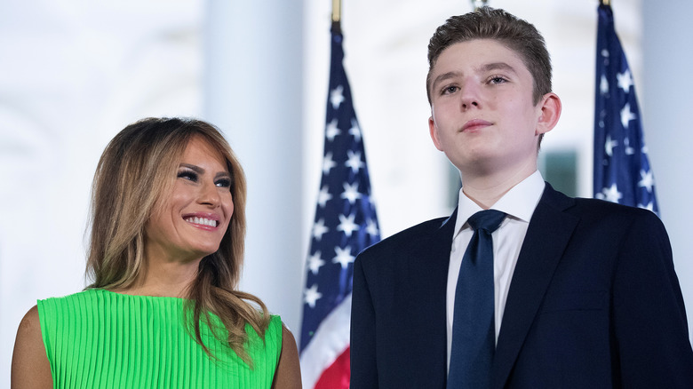 Melania Trump smiles up at teenage Barron