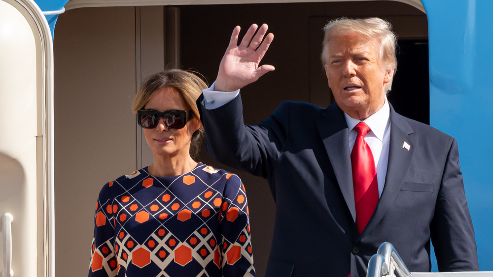 Melania Trump and Donald Trump wave