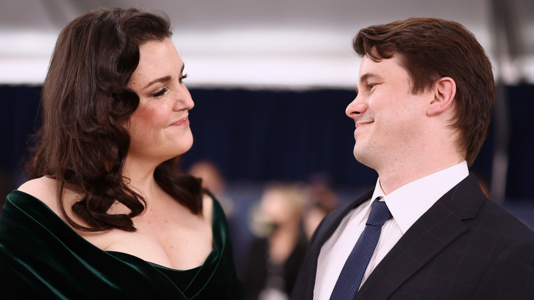 Melanie Lynskey and Jason Ritter smiling at each other