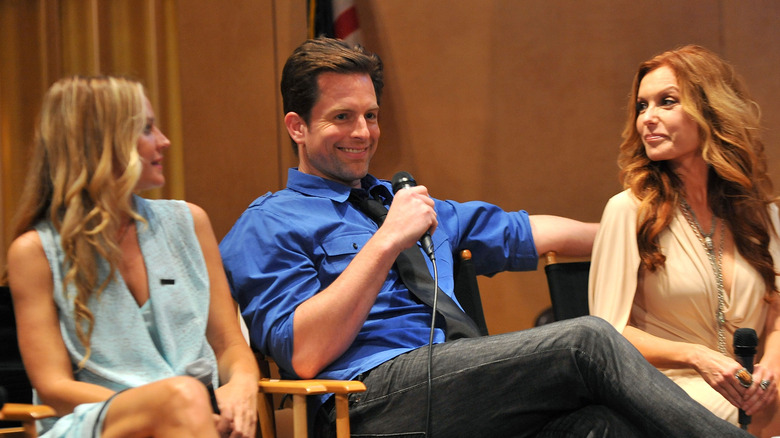 Michael Muhney sitting with a microphone