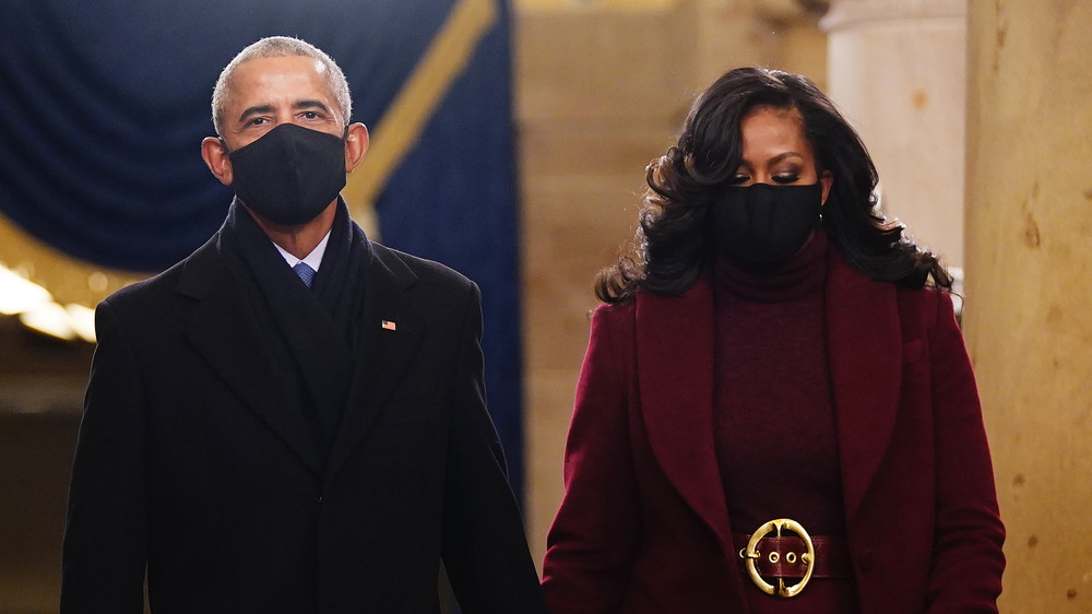 Former US President Barack Obama (L) and Michelle Obama arrive in the Crypt of the US Capitol for President-elect Joe Biden's inauguration ceremony to be the 46th President of the United States on January 20, 2021 in Washington, DC.