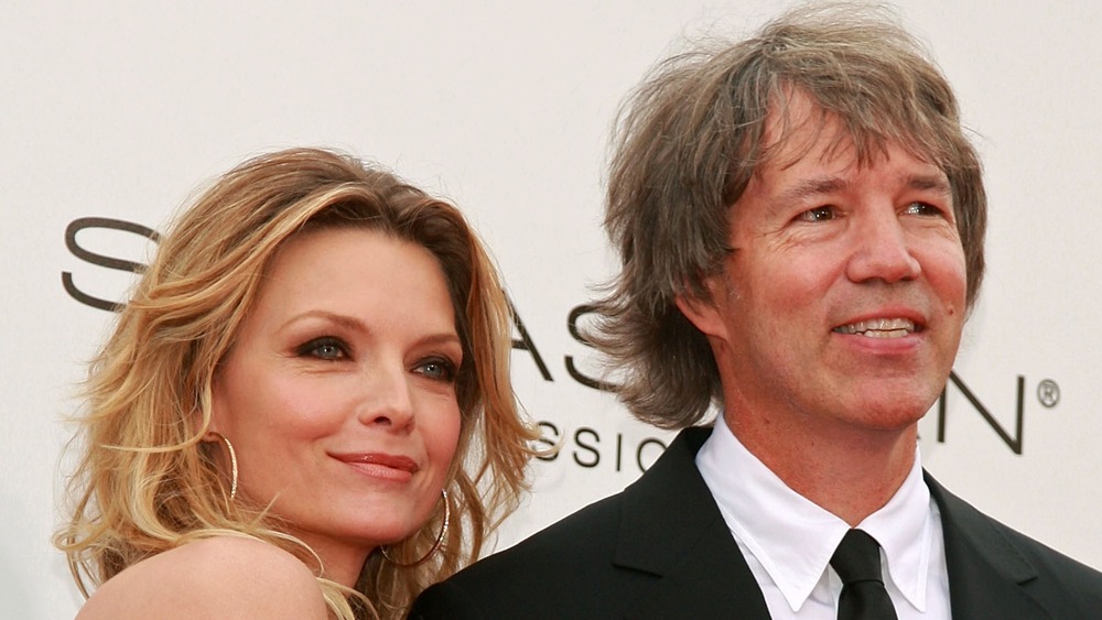 Michelle Pfeiffer and David E. Kelley posing together