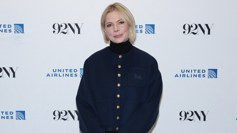 Michelle Williams in navy blue jacket