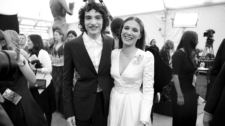 Millie Bobby Brown and Finn Wolfhard smiling
